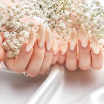 Female Hands on a white silk background with beautiful pearl man